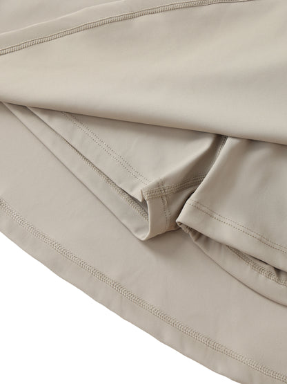 ARĒTÉ High-Waist Pocketed A-Line Skirt